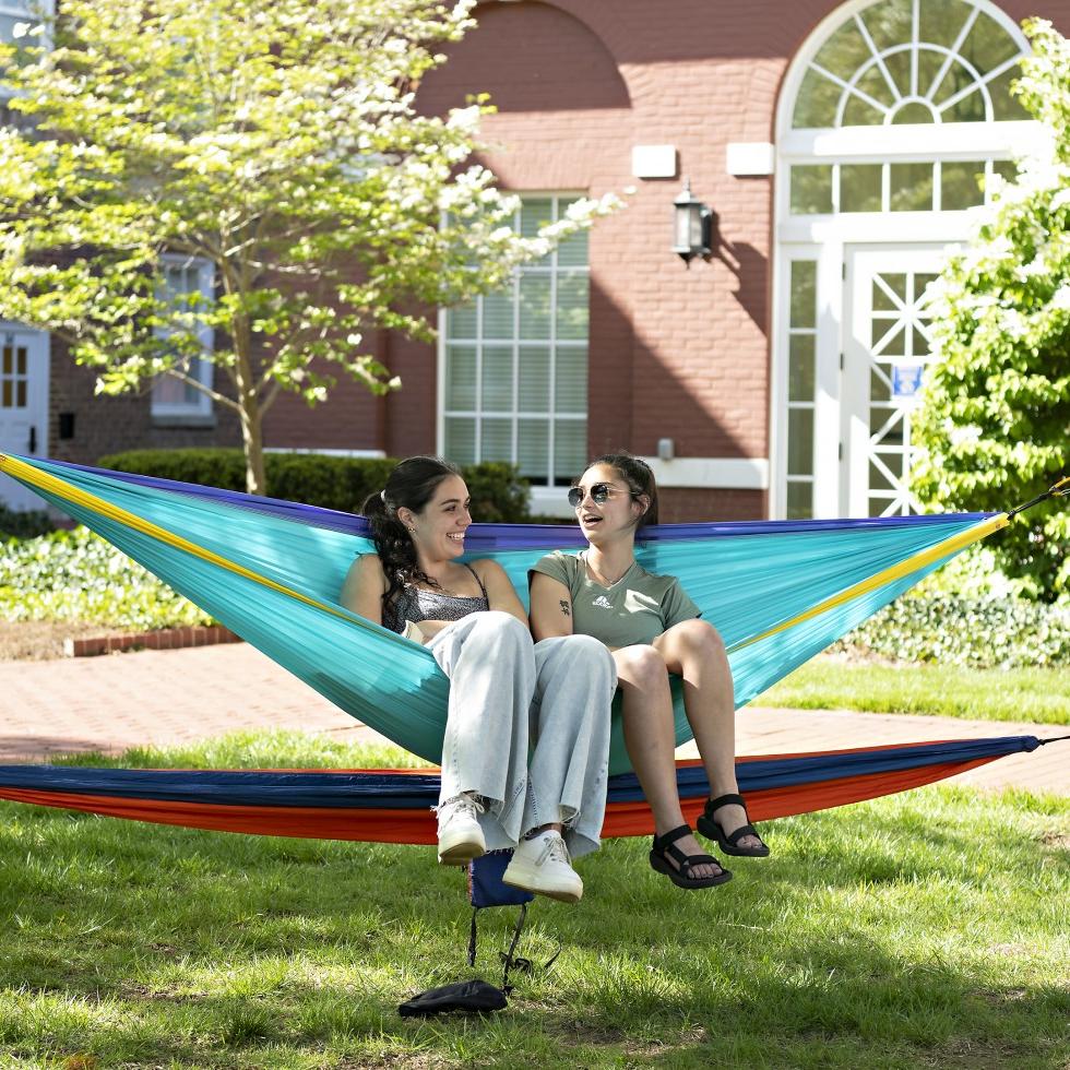 two students in a hammock