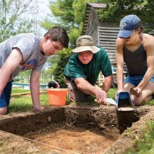 students around a dig site